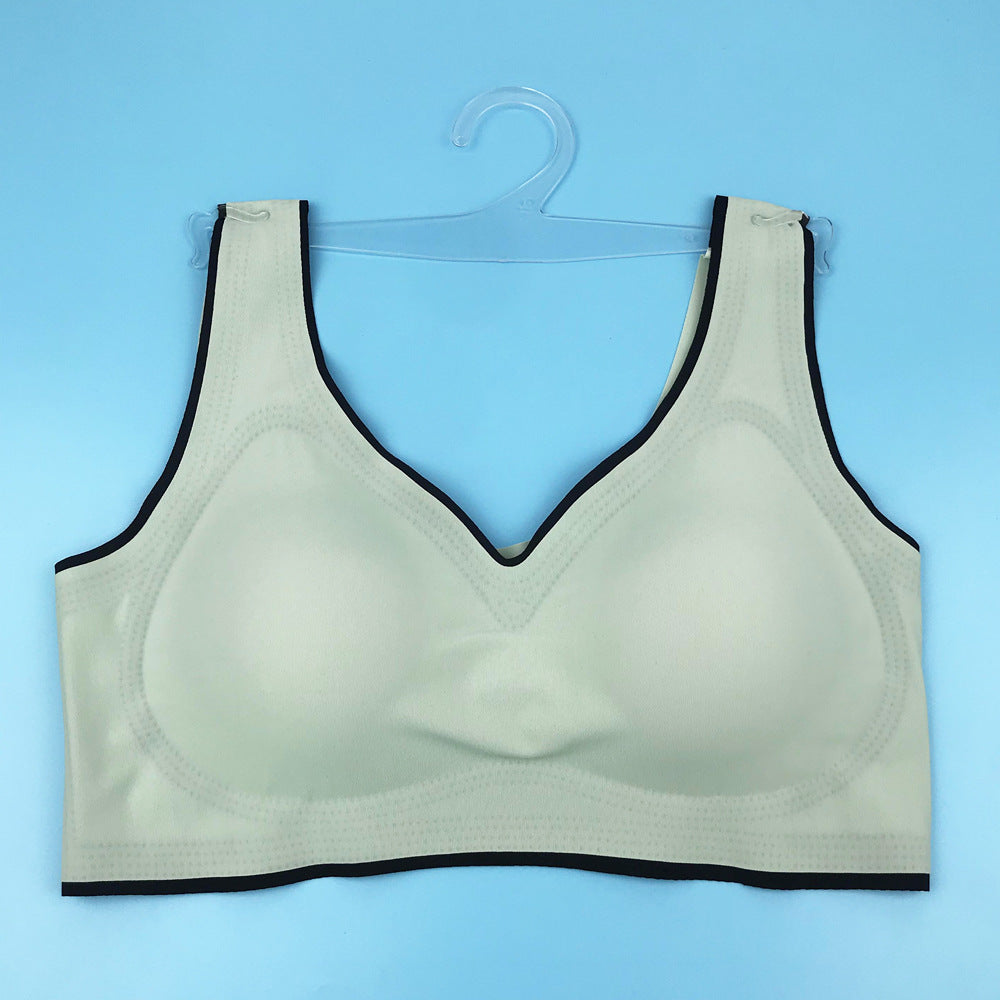 Seamless underwire-free bra in white with V-neck and dark trim on edges