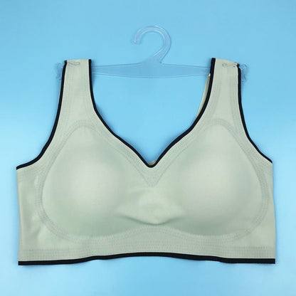 Seamless underwire-free bra in white with V-neck and dark trim on edges