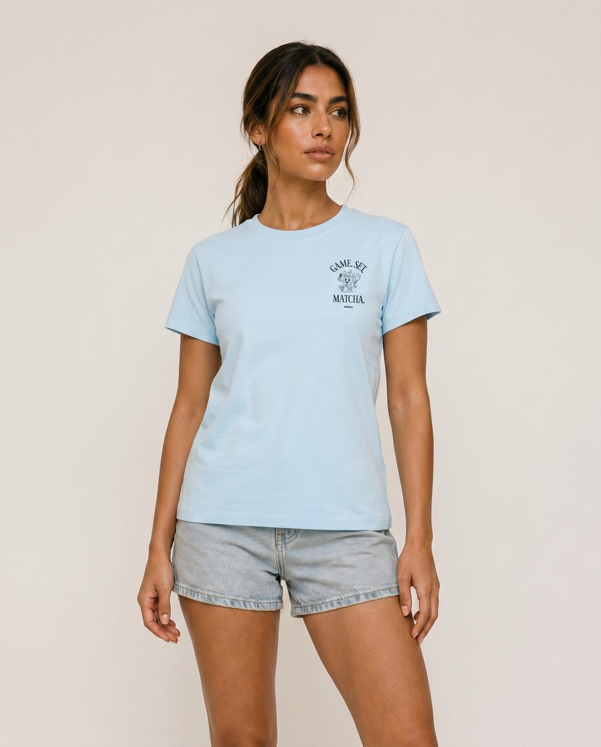 Light blue crewneck t-shirt with "Game, Set, Matcha" logo on left chest.