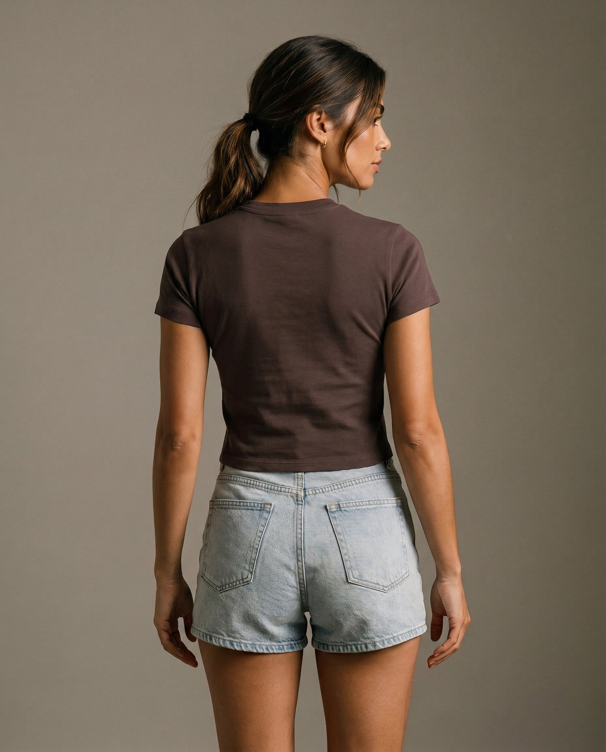 Brown short-sleeve crewneck T-shirt with small chest graphic logo, plain back