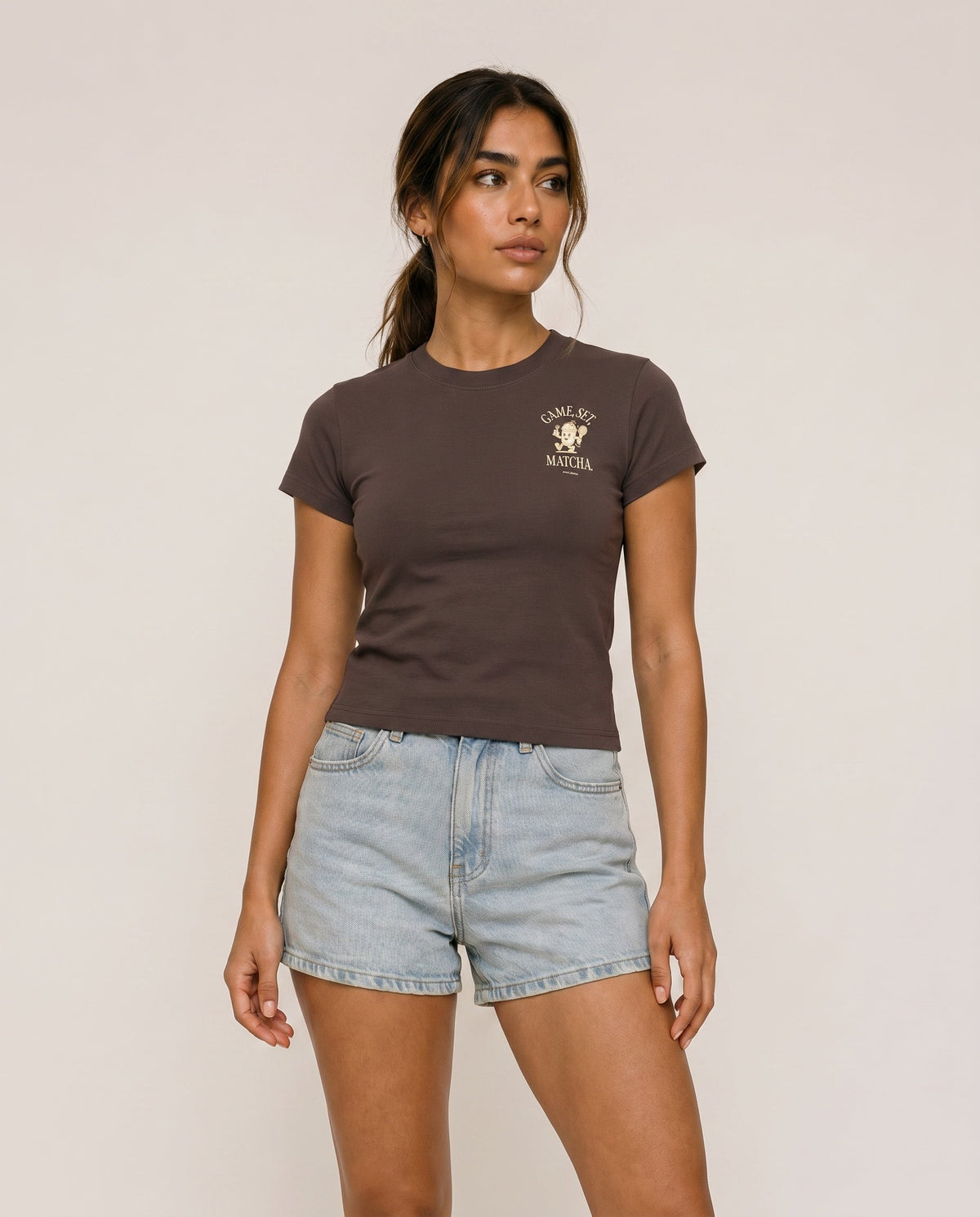 Brown short-sleeve crewneck T-shirt with small chest graphic logo and plain front