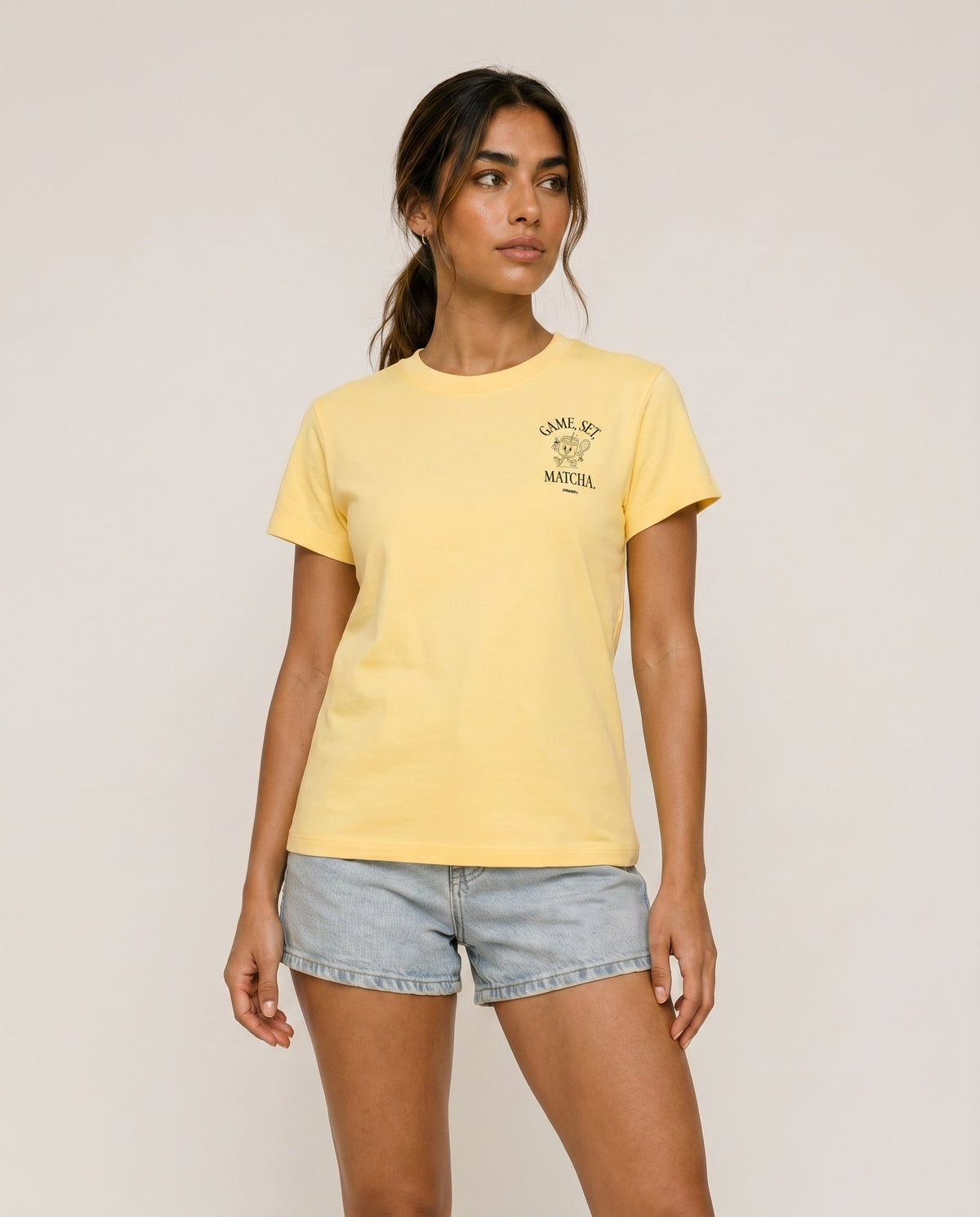 Yellow crewneck T-shirt front view with small chest logo print