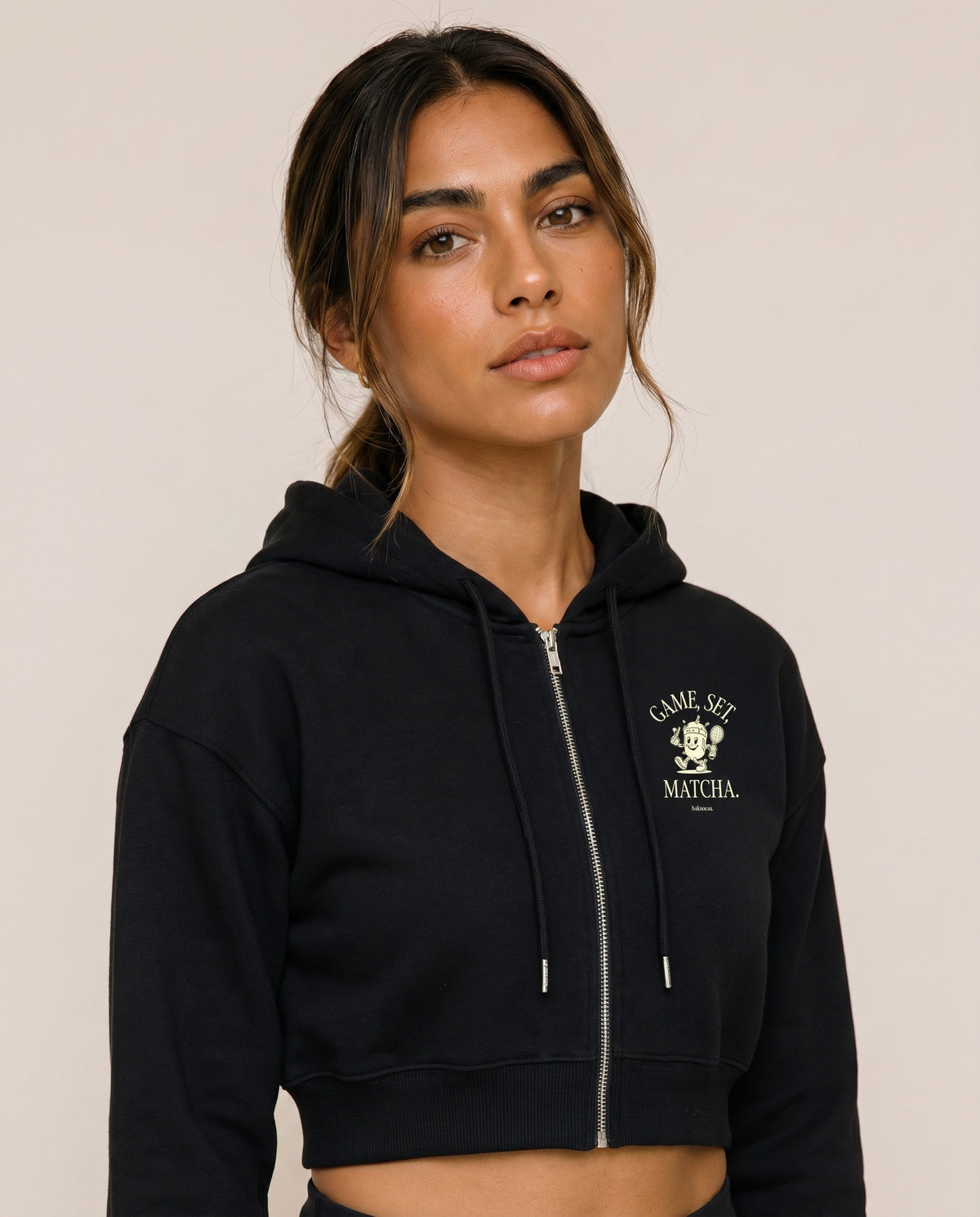 Black cropped zip hoodie, hood with drawstrings, front logo print.