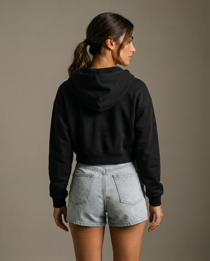 Black cropped hoodie from the back with hood and long sleeves.