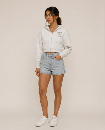 Light gray cropped zip hoodie with hood drawstrings and small chest logo.