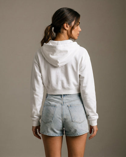 Back view of cropped zip hoodie in white with hood and drawstring