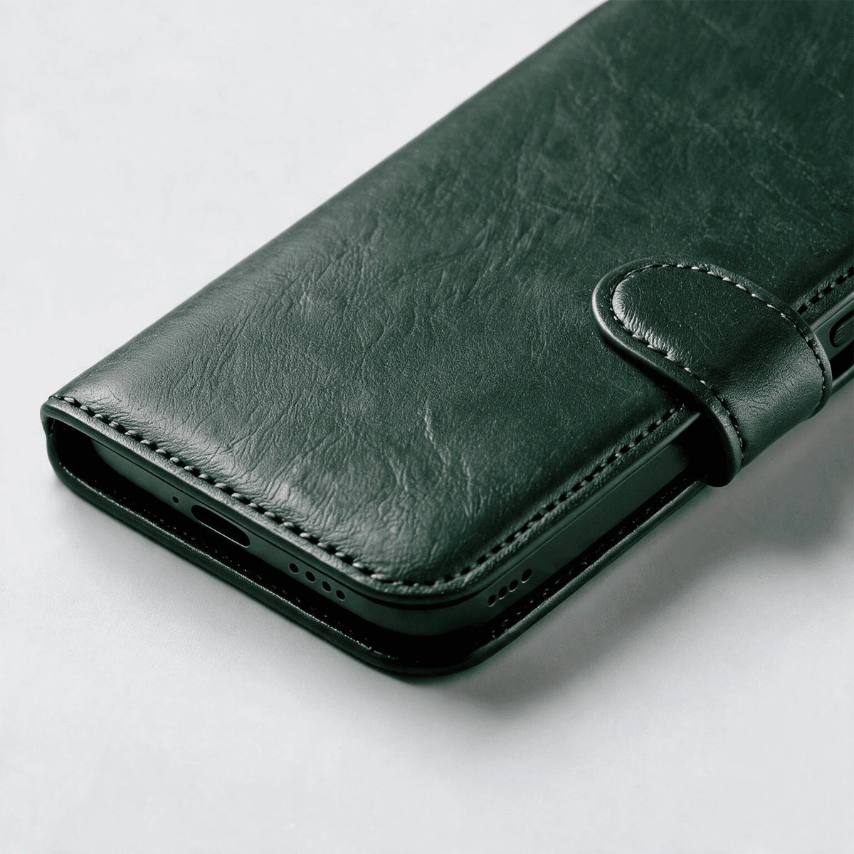 Leather-look wallet phone case, dark green folio with snap strap and stitched trim
