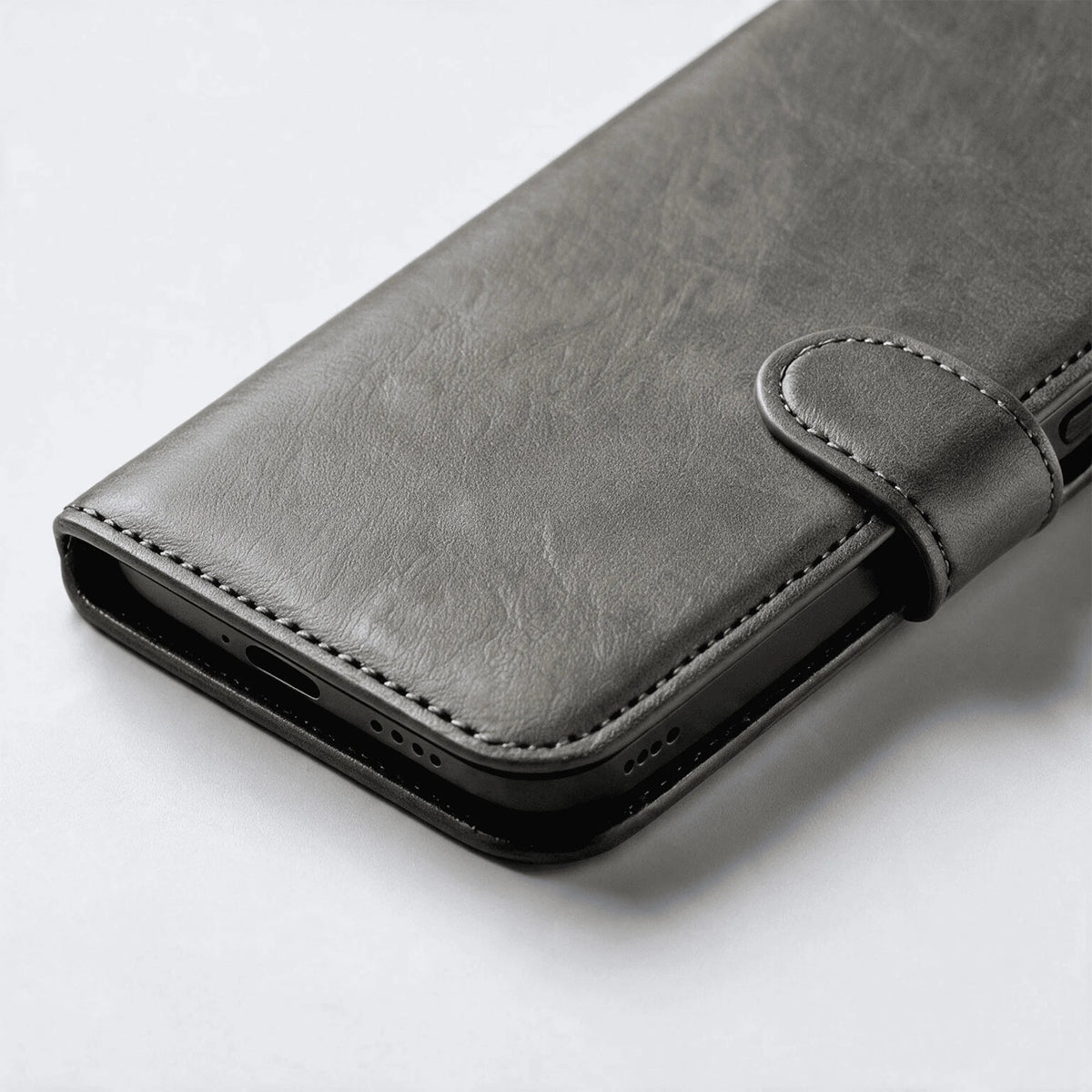 Leather-look wallet phone case, grey folio with stitched edges and snap strap