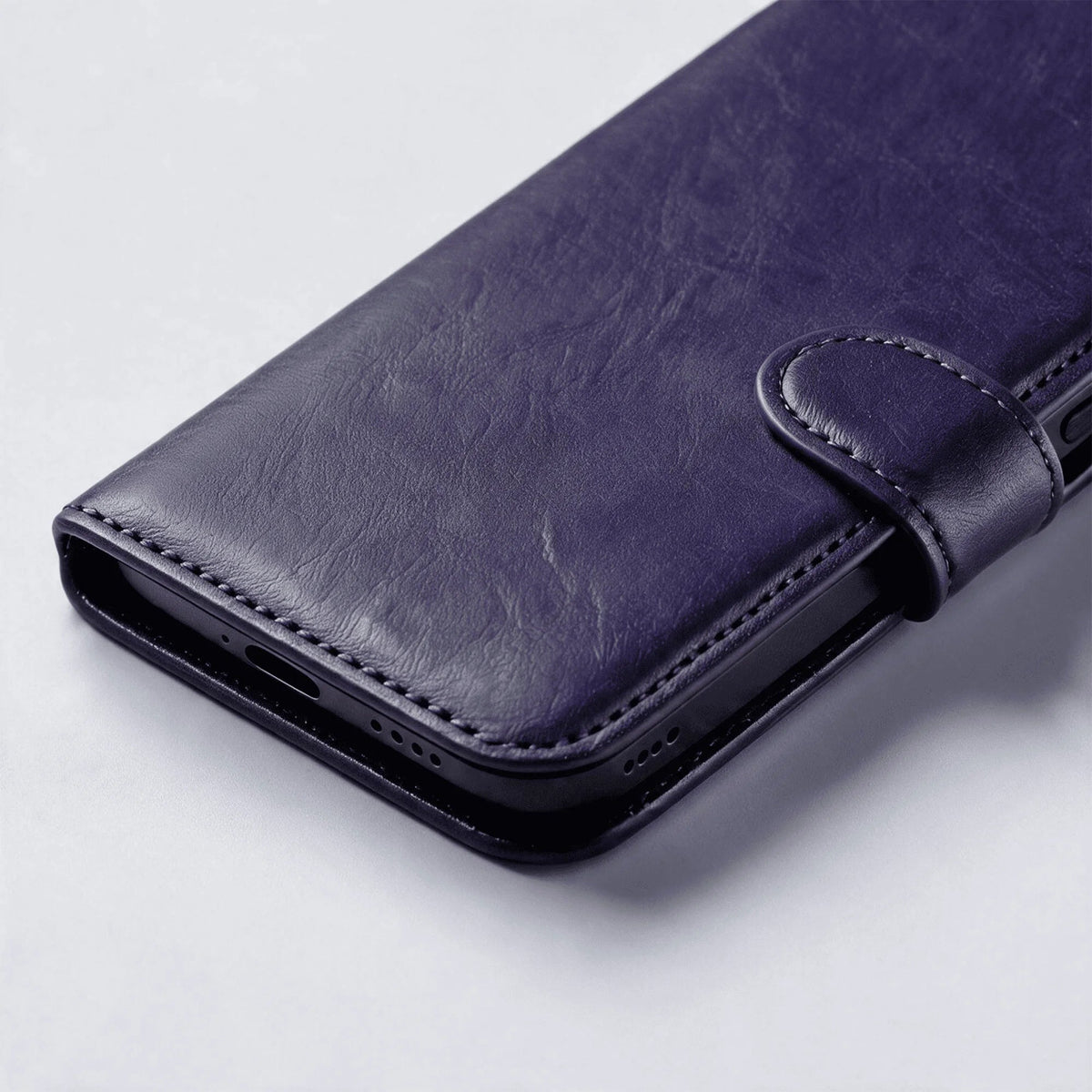 Purple leather-look wallet phone case with flip cover and matching strap tab