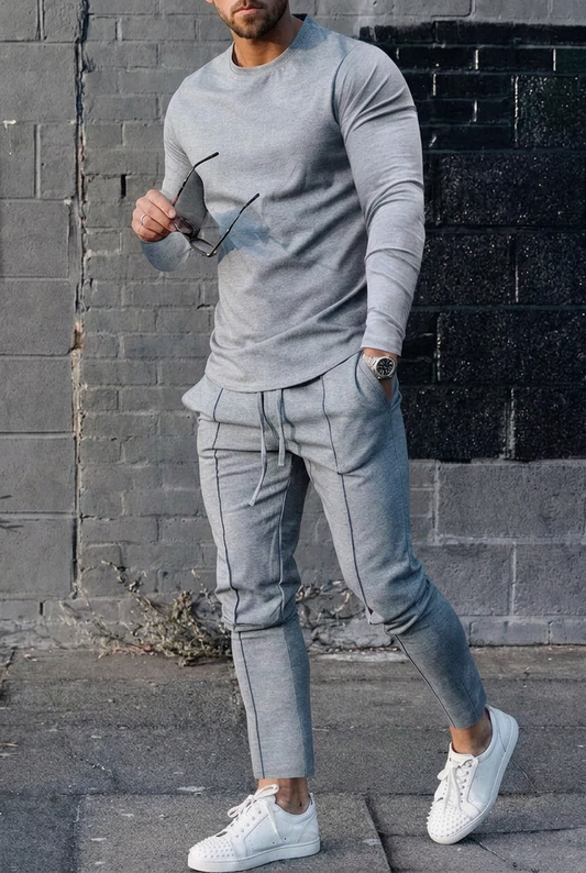 Men's long-sleeve top and joggers set in light gray, joggers with drawstring waist.