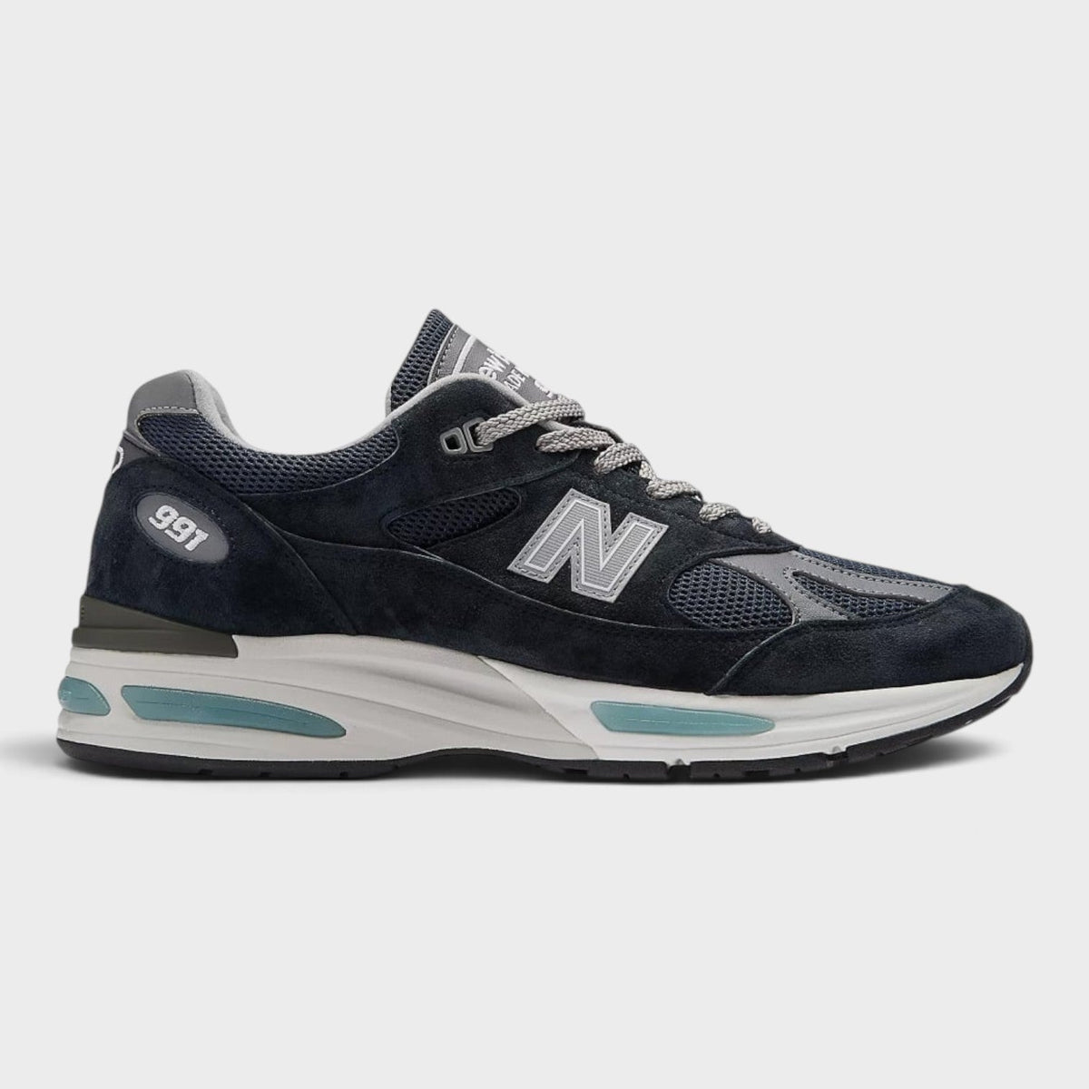 Dark navy New Balance 991v2 lace-up sneakers with N logo and cushioned midsole