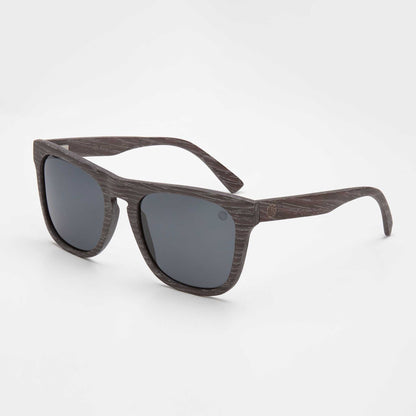 Black sunglasses with dark gray lenses and rectangular frame, side view