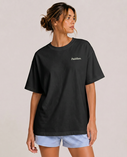 Black heavyweight T-shirt with small 'Padelsim' chest logo worn by model
