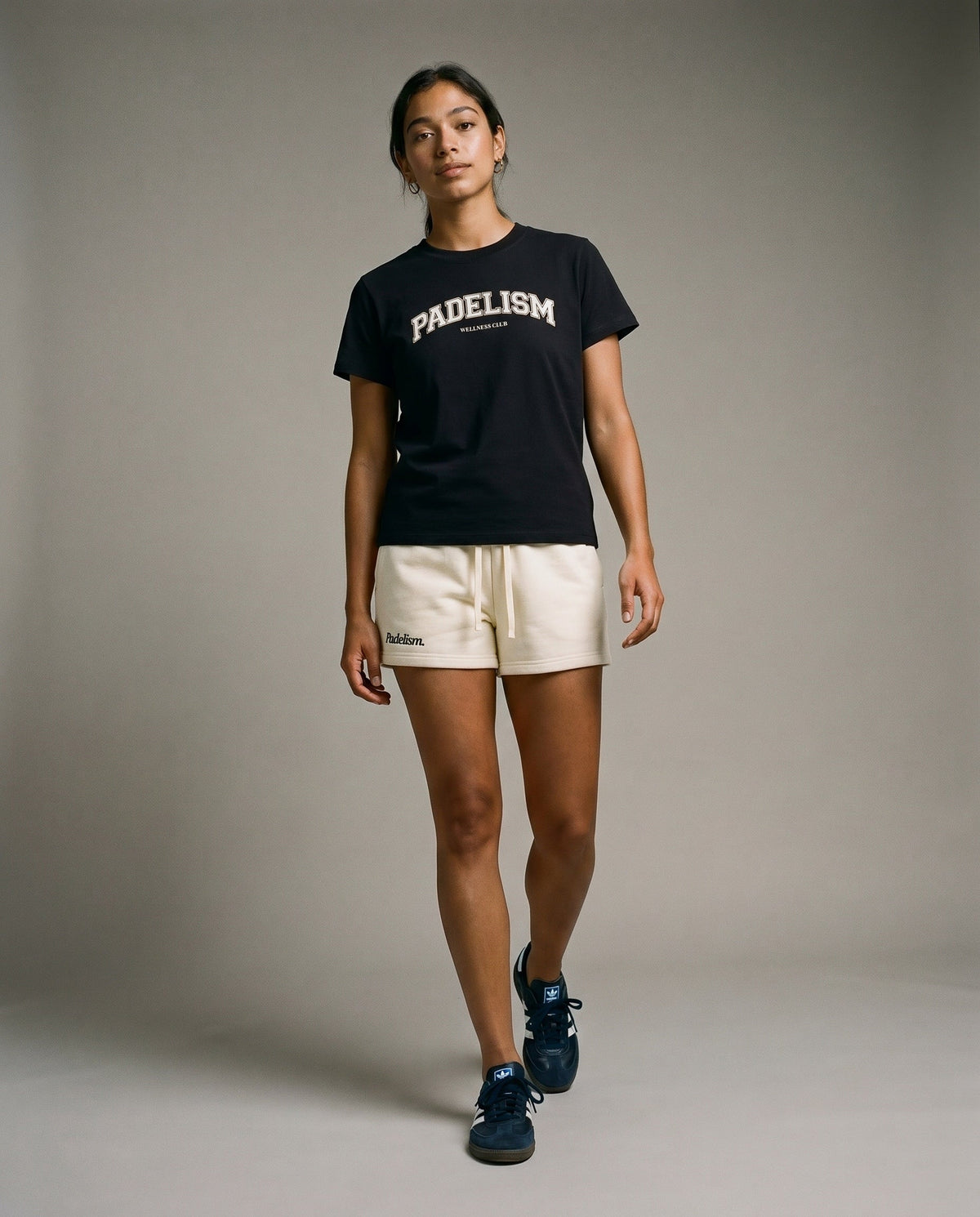 Cream core athletic shorts with elastic waistband and drawstring, side pockets