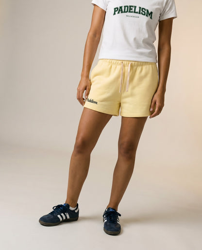 Padelism core shorts, yellow with drawstring waist and side pockets, front view