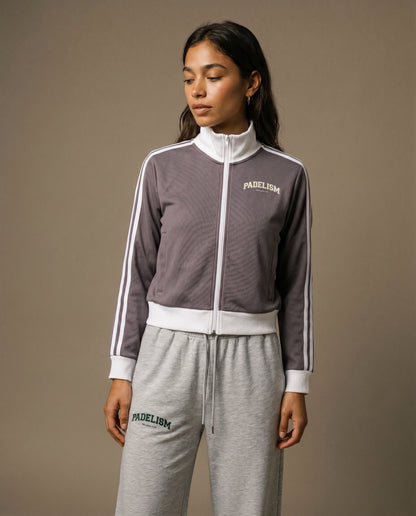 Plum purple track jacket with white zipper, striped sleeves, and chest logo