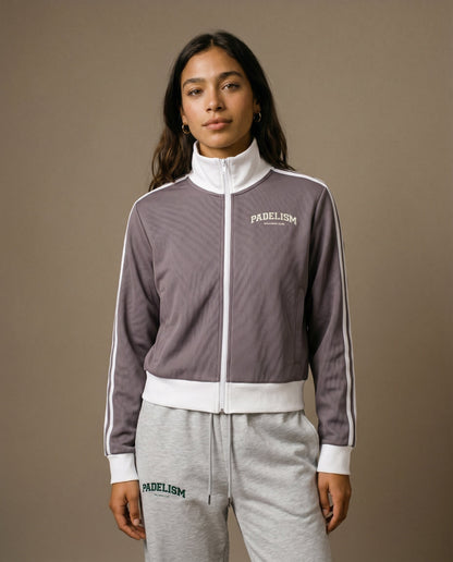 Plum purple track jacket with white zipper, striped sleeve panels, chest logo