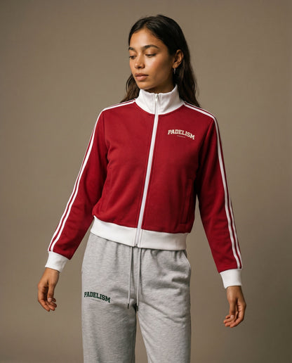 Red track jacket with white zipper, striped sleeves, and small chest logo