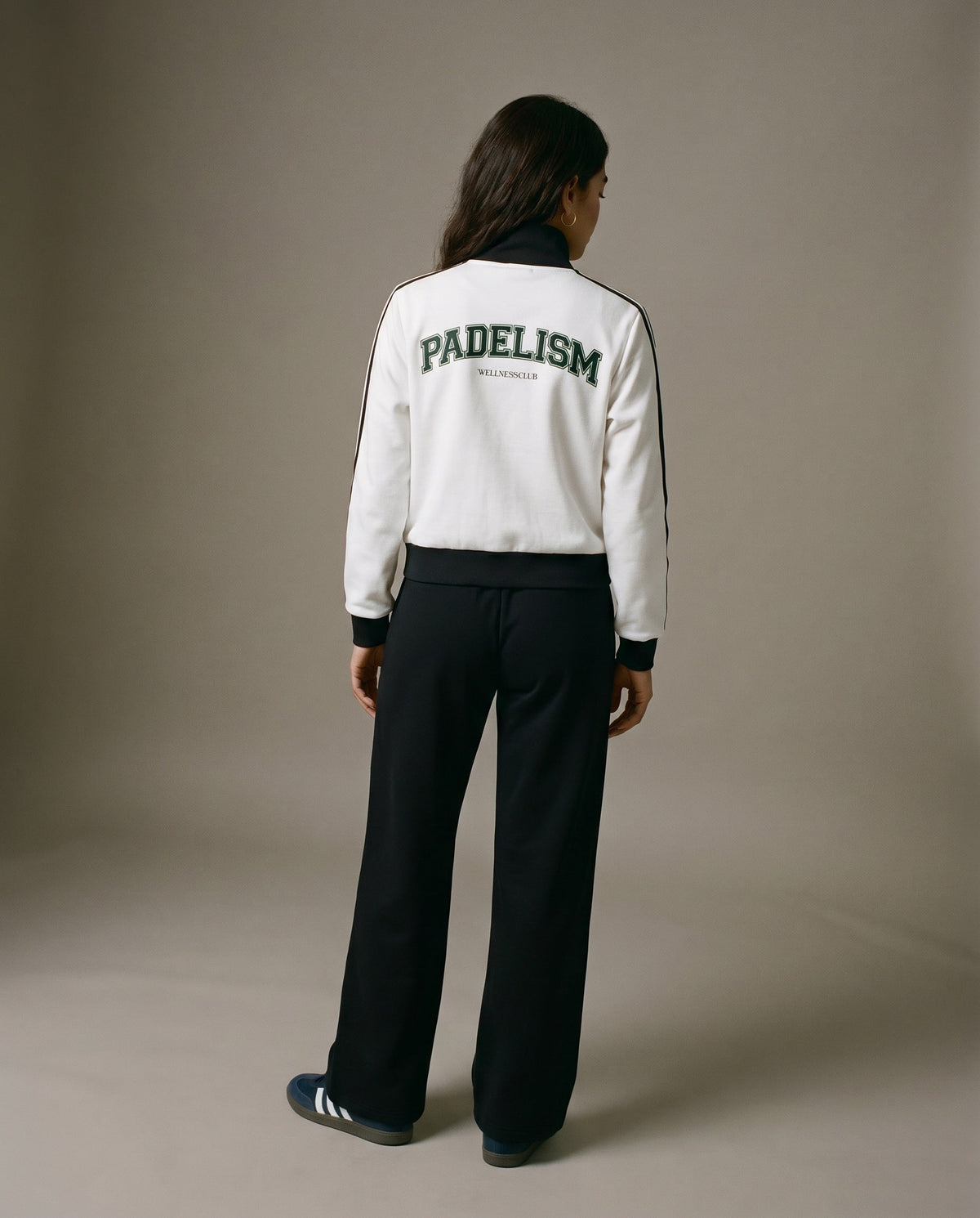 White track jacket (back view) with black collar trim and Padelism logo