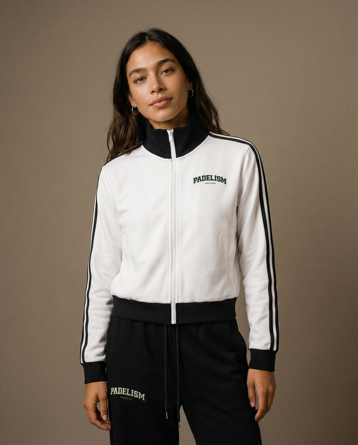 White track jacket with black cuffs, stand collar, and center front zipper