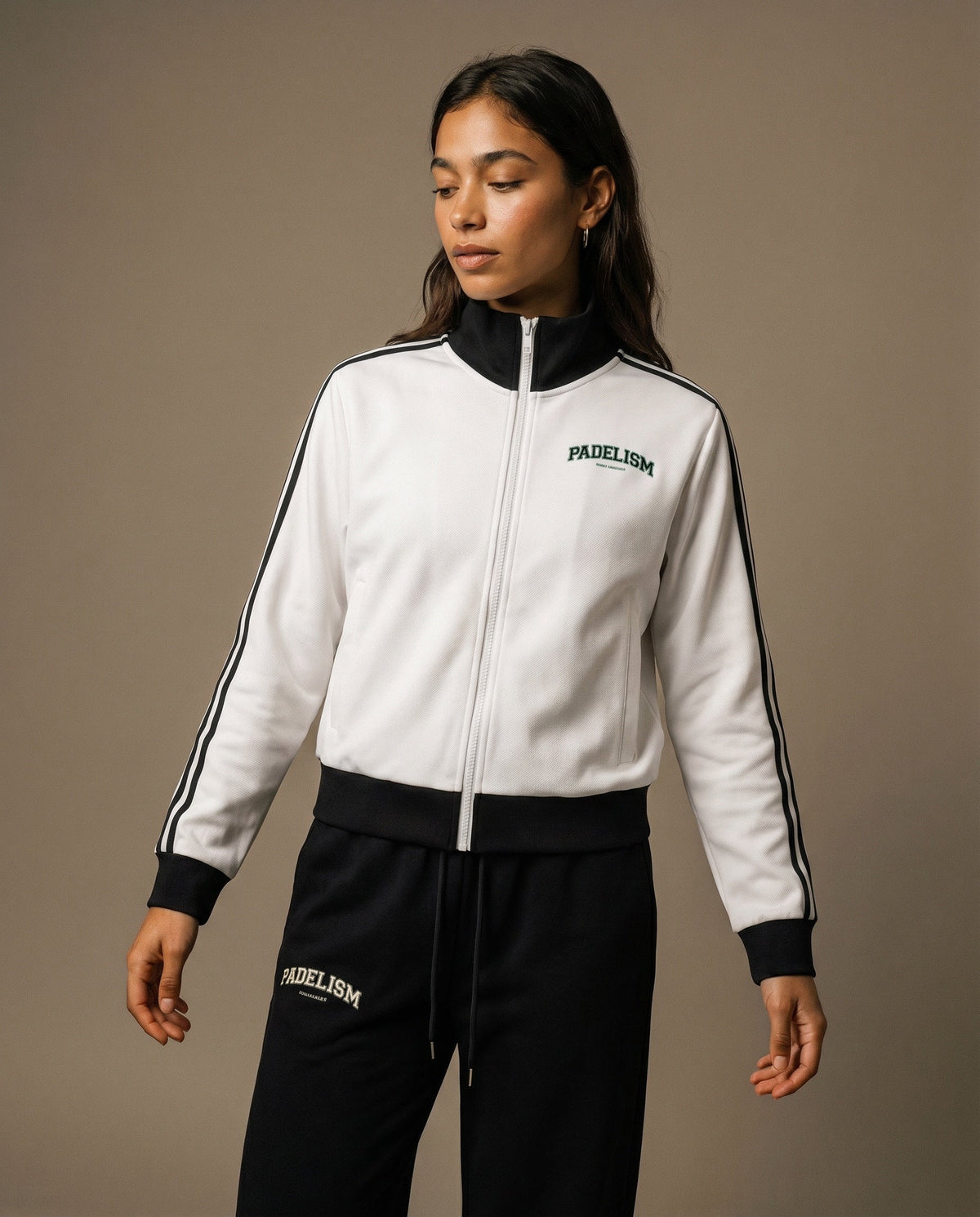 White track jacket with black collar and cuffs, front zipper, and Padelism logo