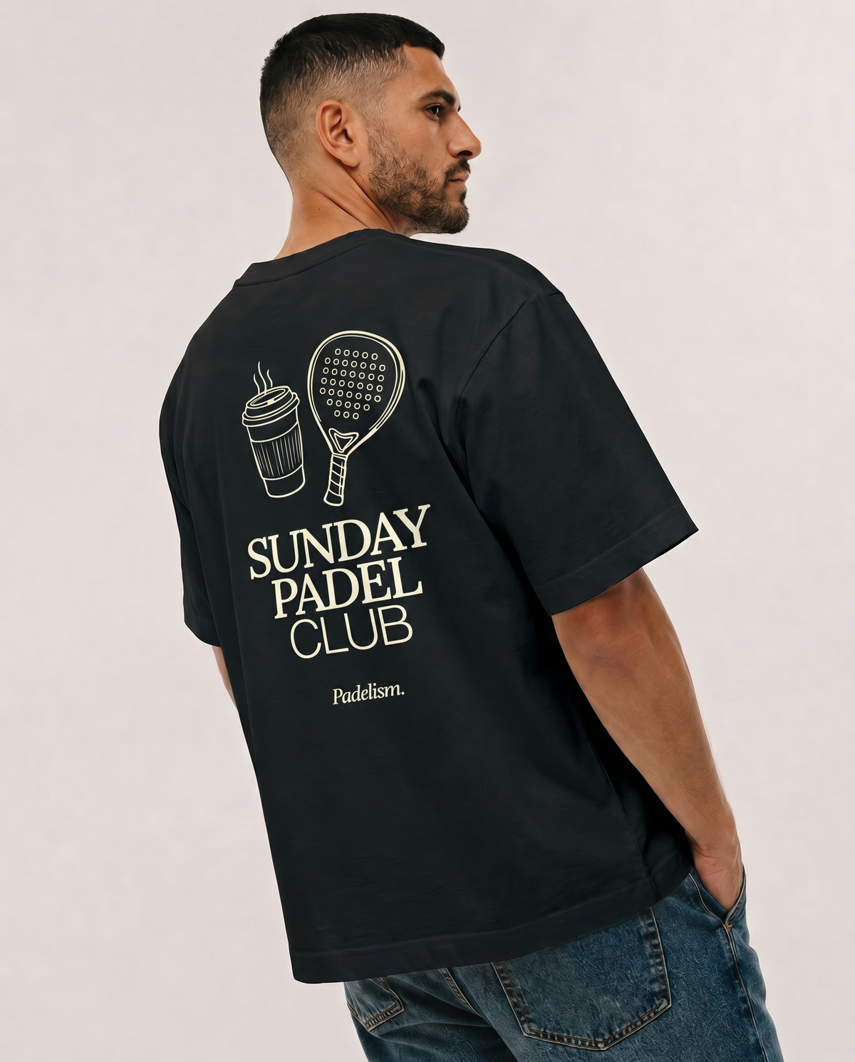 Heavyweight black t-shirt on model, crew neck, large back “Sunday Padel Club” graphic