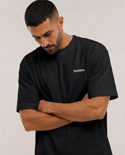 Heavyweight black t-shirt on model, crew neck, small chest logo print