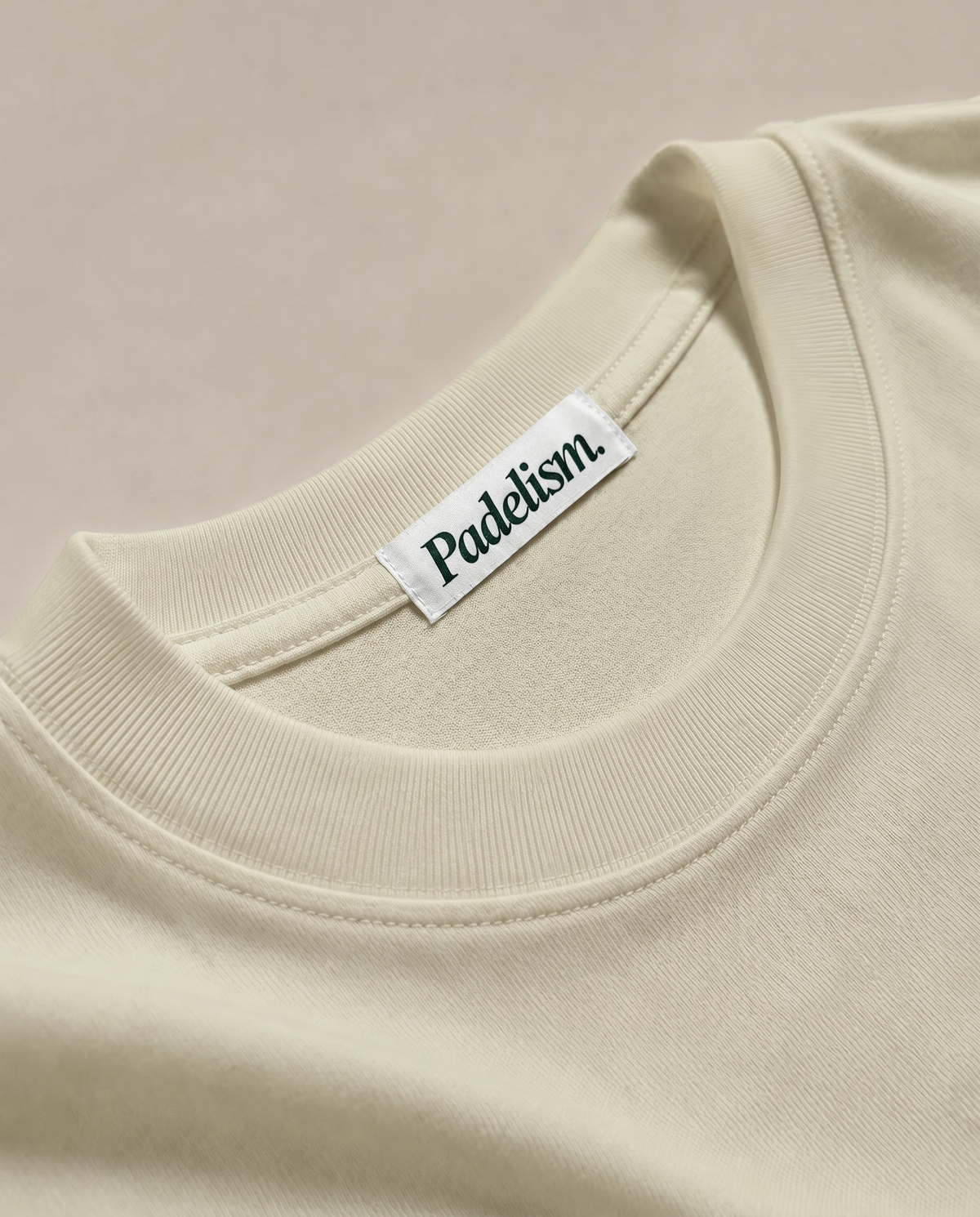 Sand color heavyweight T-shirt with crew neck seam and woven brand neck label