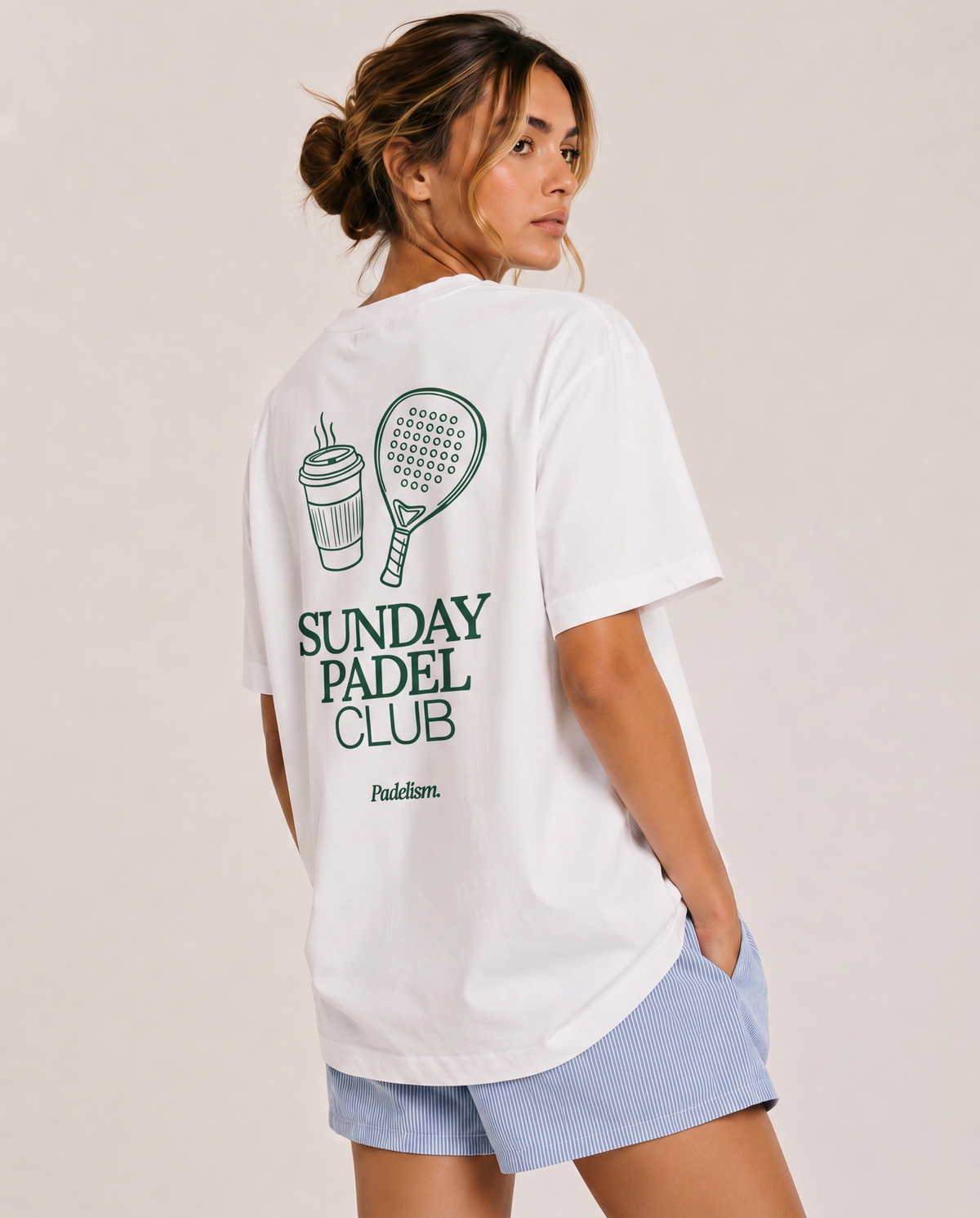 Heavyweight white t-shirt on model, crew neck, large back “Sunday Padel Club” graphic
