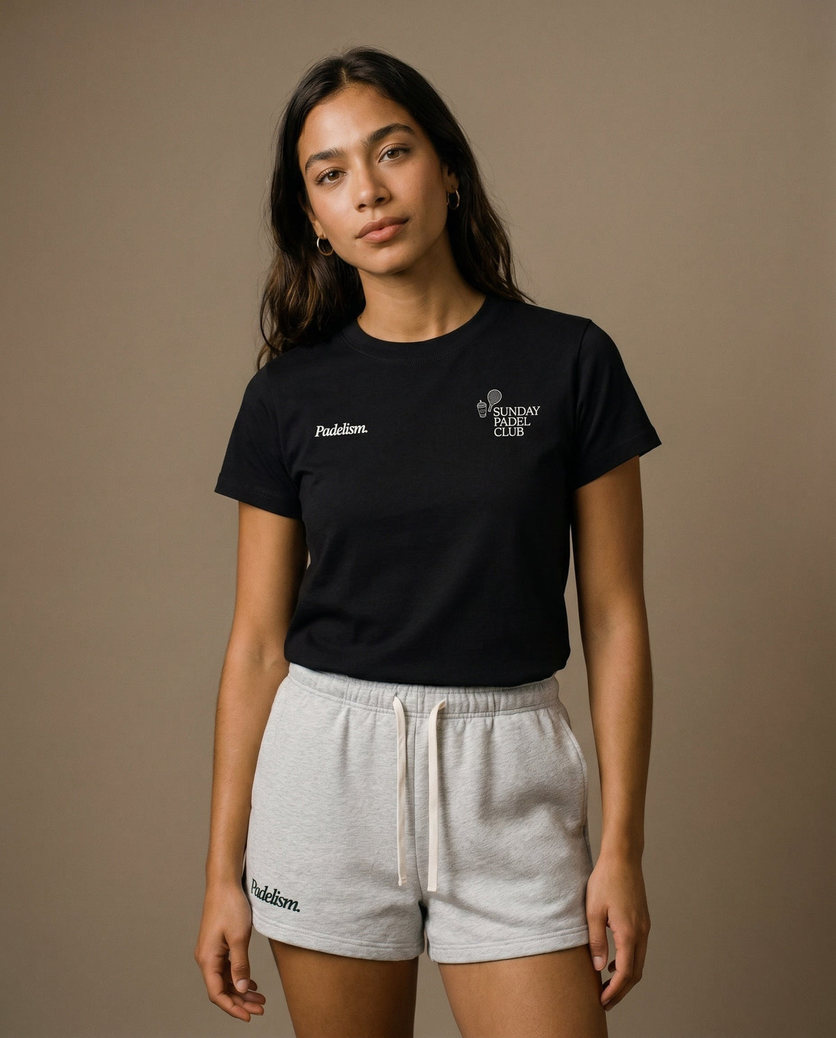 Black crewneck t-shirt with chest graphic text and emblem on the front.