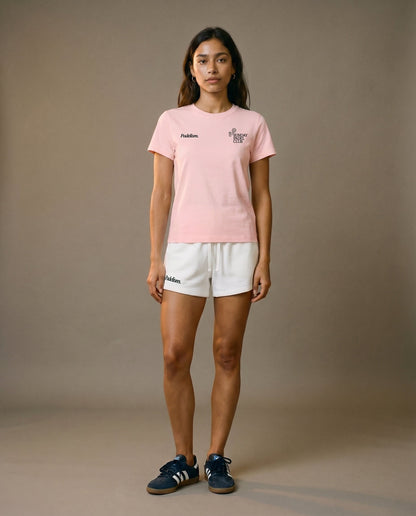 Pink crewneck short-sleeve t-shirt with chest prints, paired with white drawstring shorts