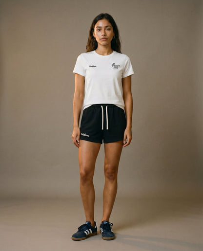White crewneck short-sleeve t-shirt with chest prints, paired with black drawstring shorts