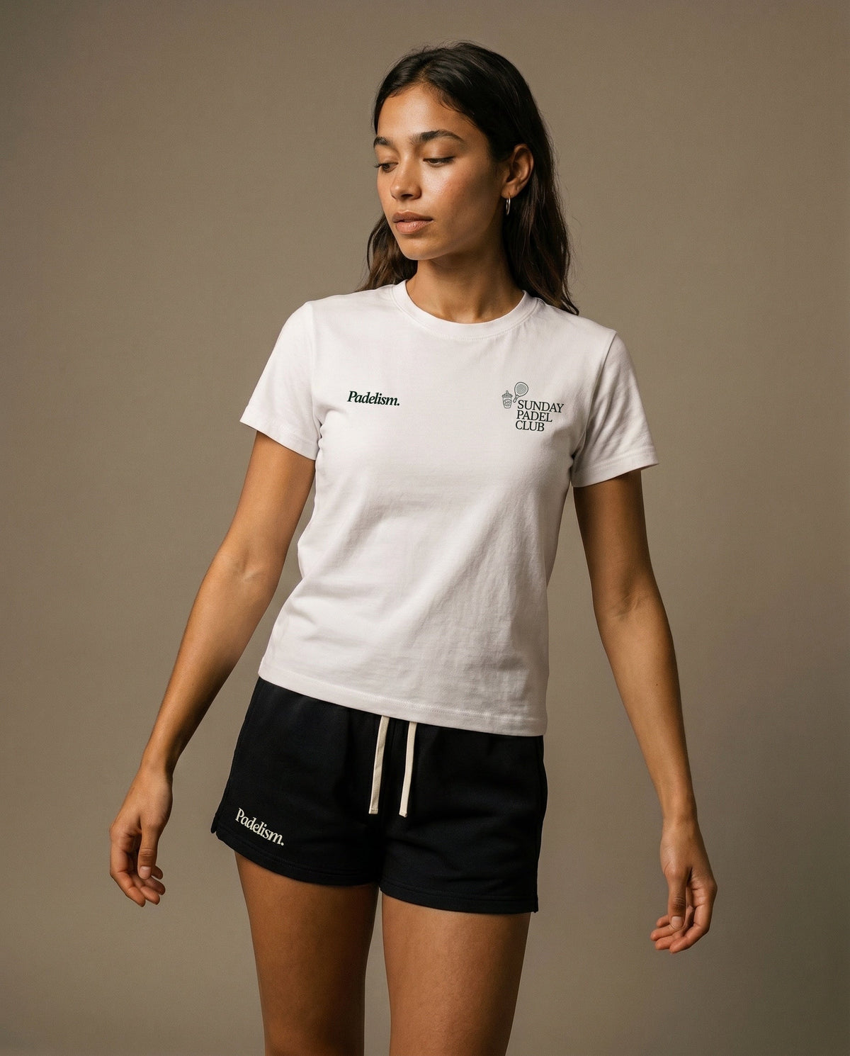 White crewneck short-sleeve t-shirt with chest prints, paired with black drawstring shorts