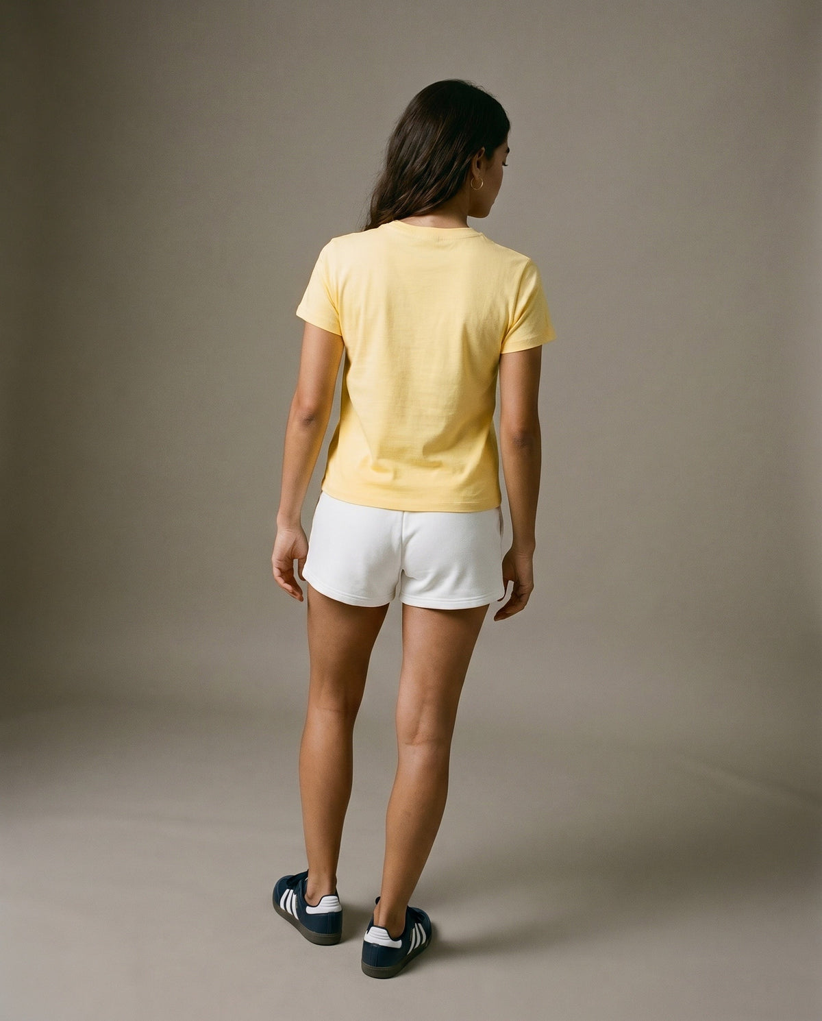 Yellow crewneck T-shirt back view, no front graphic visible