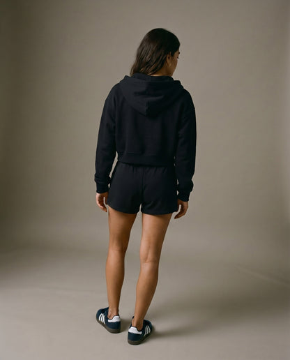 Black cropped zip-up hoodie and drawstring shorts set, back view