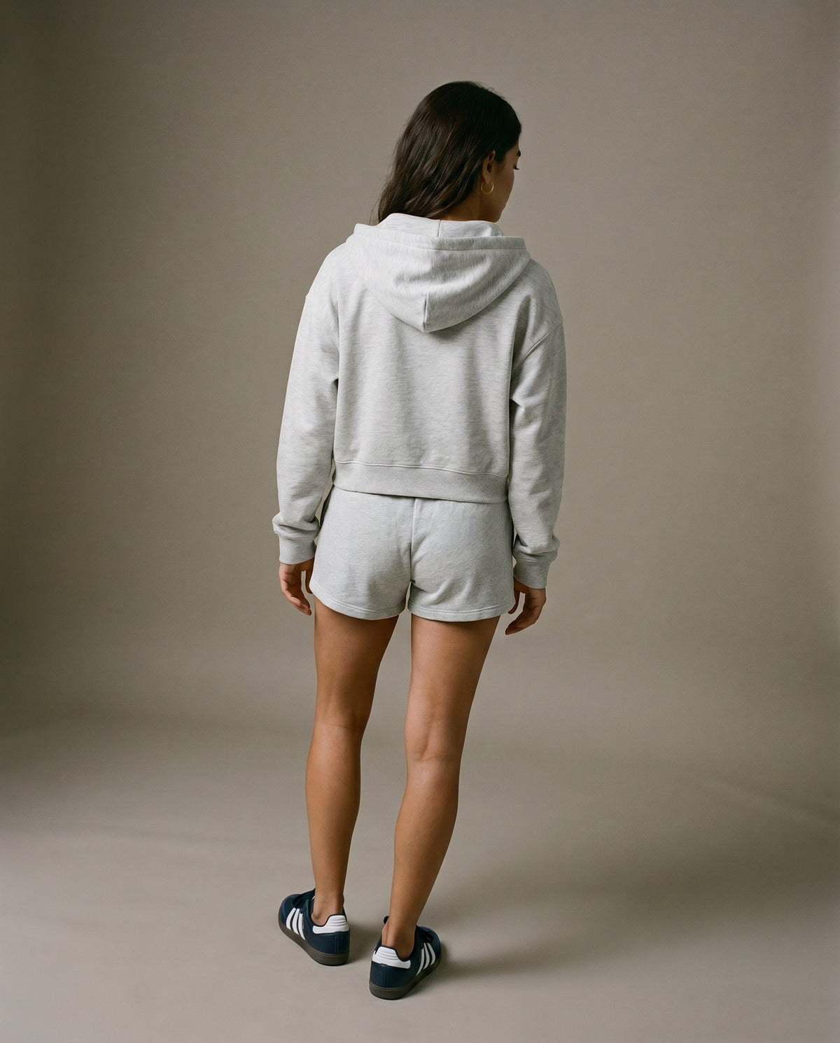 Light gray cropped zip-up hoodie and drawstring shorts set, back view