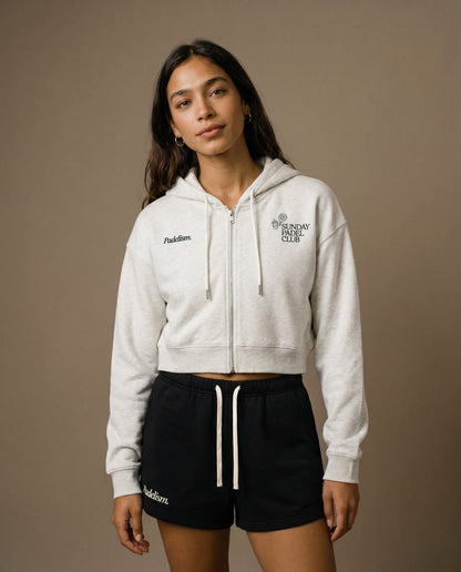 White cropped zip-up hoodie and black drawstring shorts set, front view