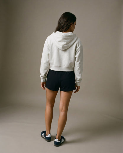 Cropped zip hoodie with hood, white fabric, back view with drawstrings visible