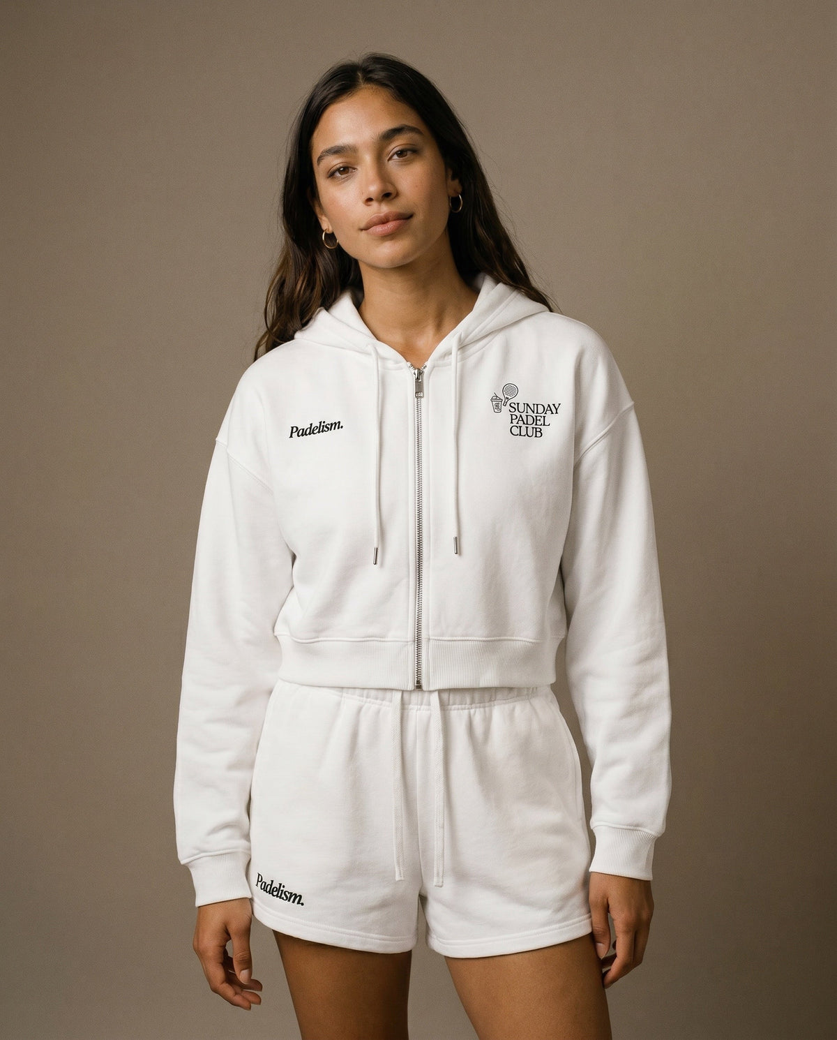 Cropped zip hoodie with hood, white fabric, front view with chest logo and drawstrings