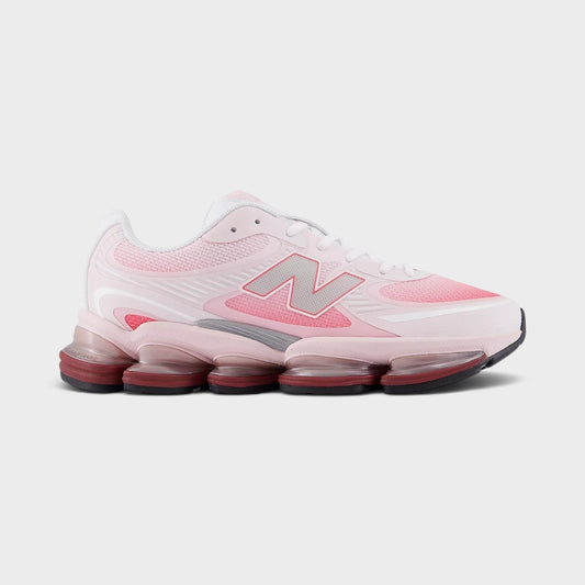 Pink lace-up sneakers with large N logo and cushioned rubber sole