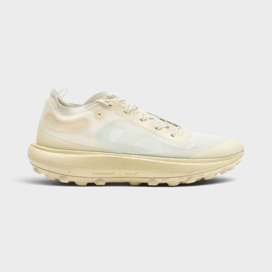 Antique white lace-up sneakers with chunky rubber sole and mesh upper.