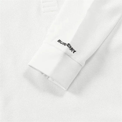 White polo sleeve cuff with Burberry logo embroidery and clean stitched hem.