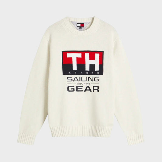 Cream knit crewneck sweater with red and black Sailing Gear logo at center
