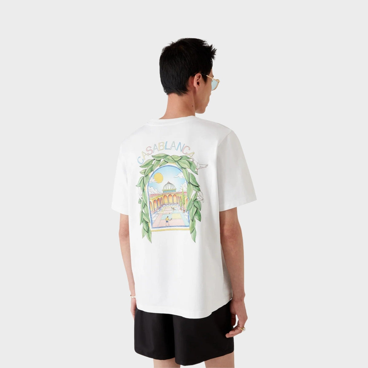 White short-sleeve T-shirt with large back graphic print, worn on model