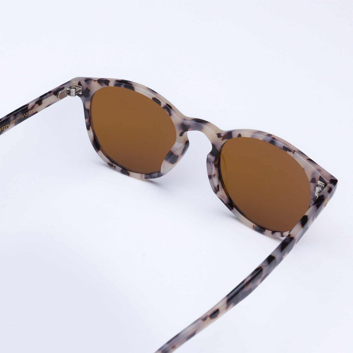 Leopard-print sunglasses side view with brown tinted lenses