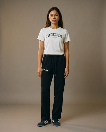 White crewneck t-shirt front view with short sleeves, worn with dark joggers.