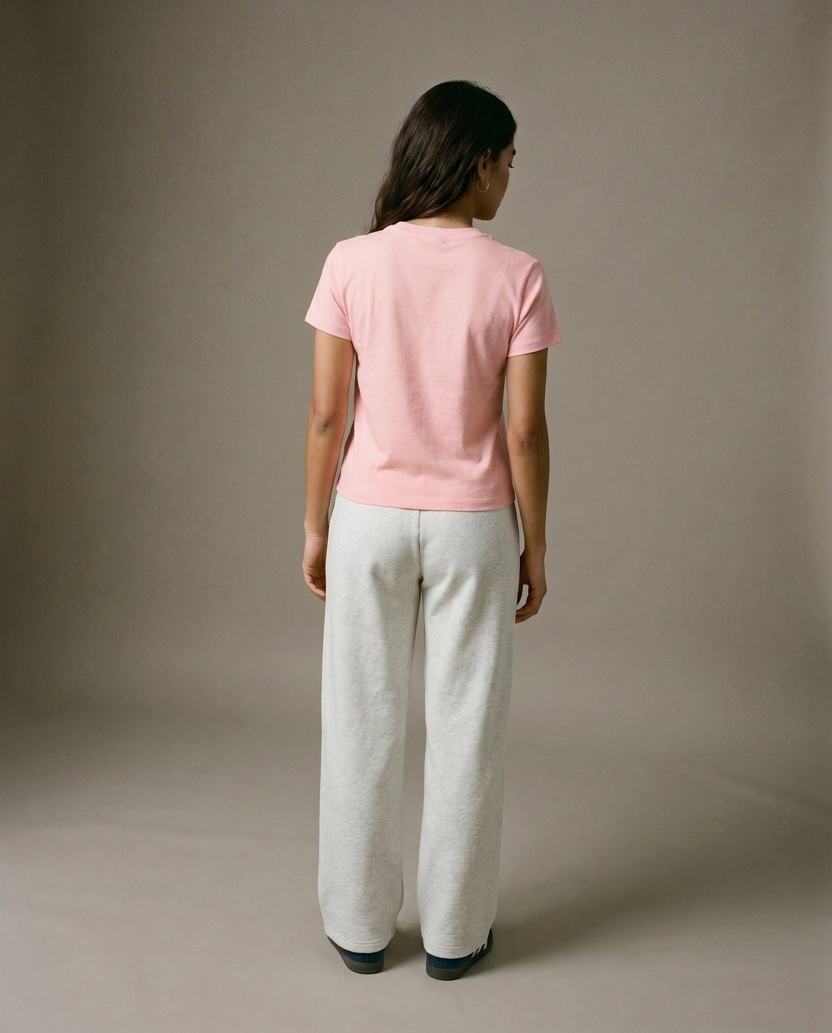 Pink crewneck t-shirt from the back with short sleeves.