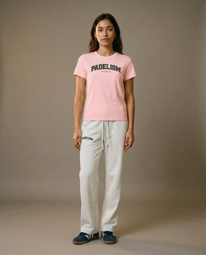 Pink crewneck t-shirt front view with short sleeves, worn with light gray pants.