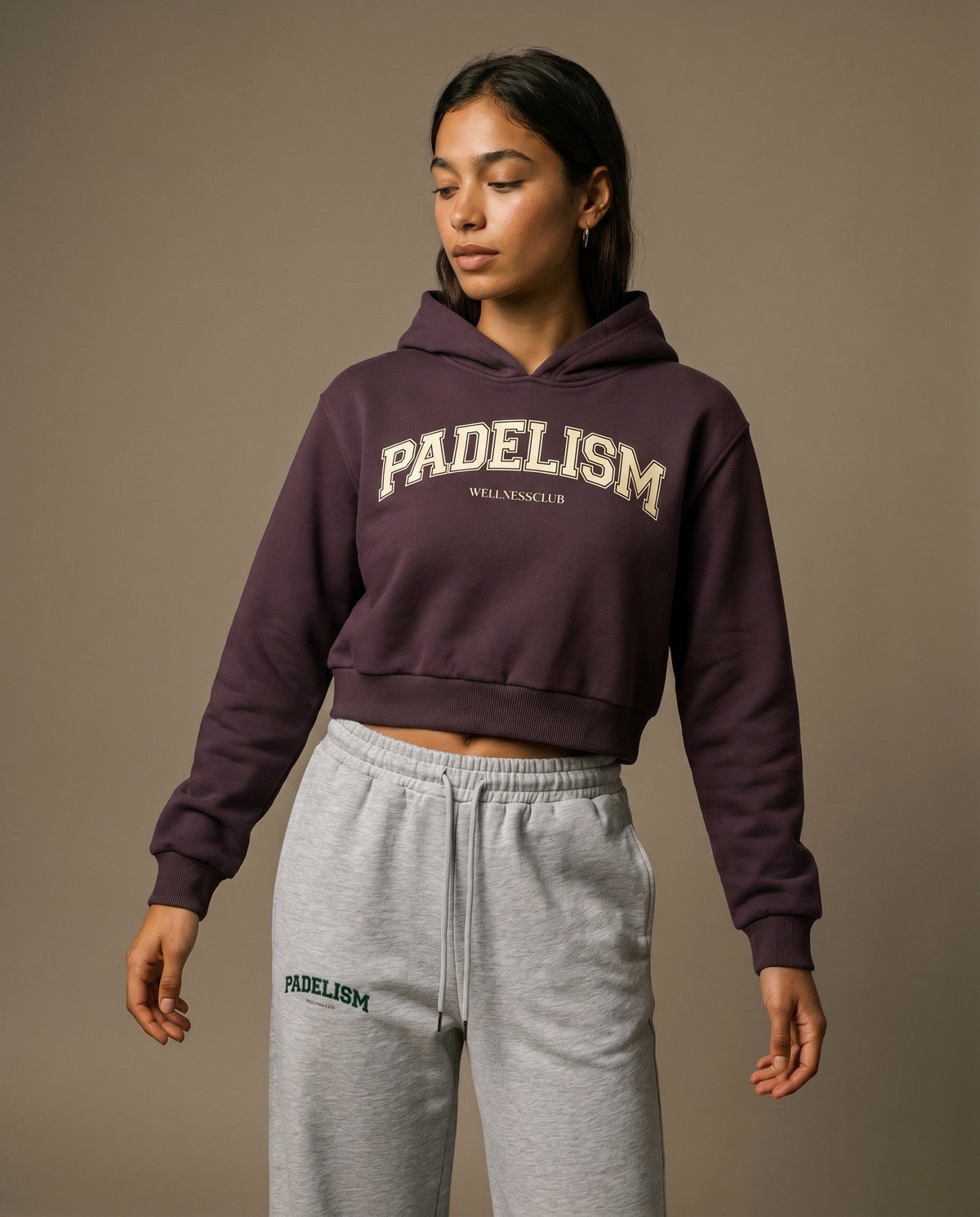 Dark reddish purple cropped hoodie with hood and front Padelism Wellness Club logo print