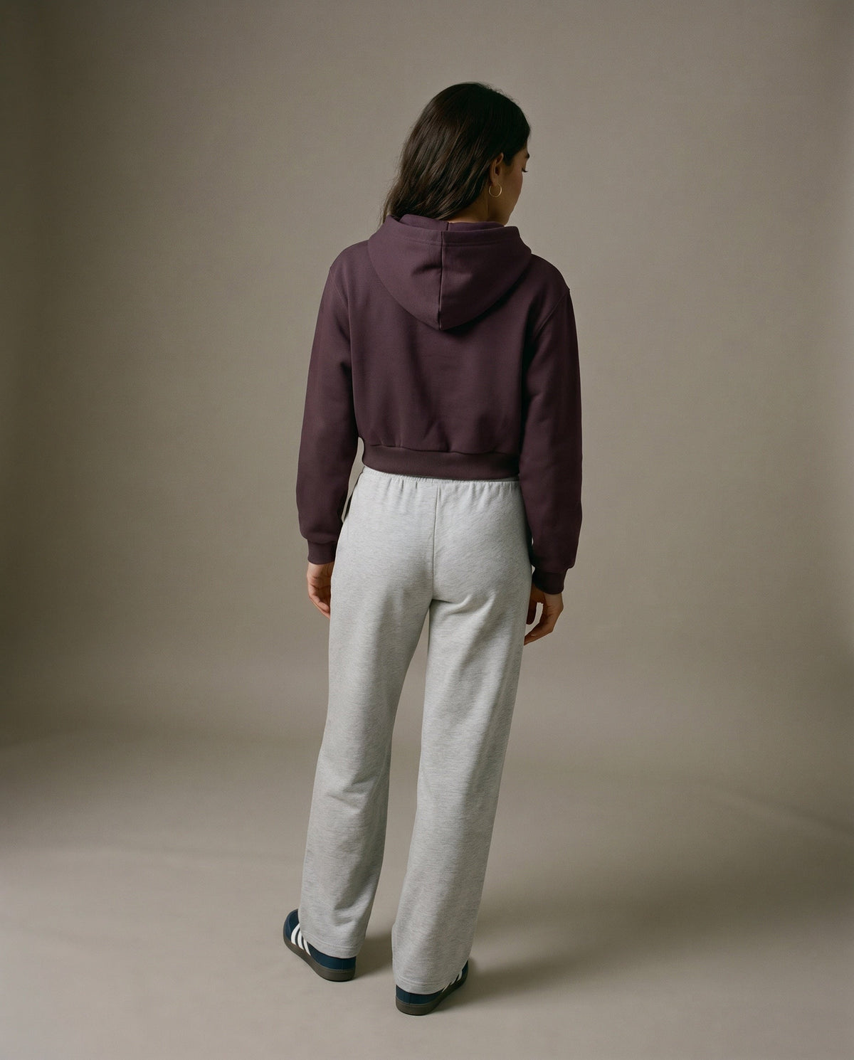 Dark reddish purple cropped hoodie with hood, shown from the back